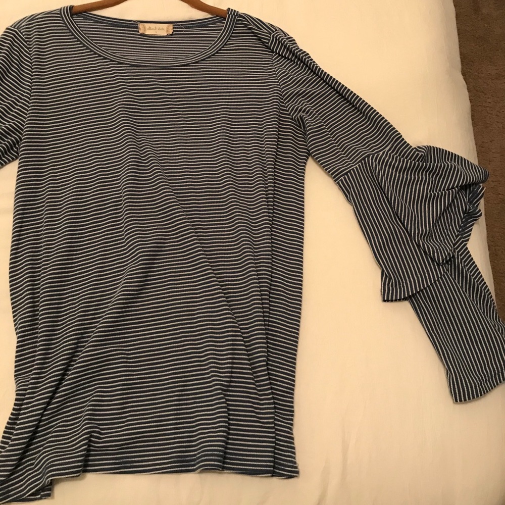 Long sleeve statement sleeve shirt.